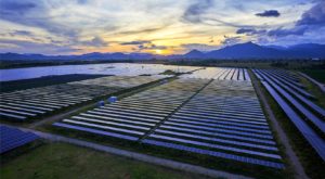 mountain sunset above solar panels